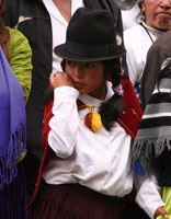 Young girl wears a tall felt hat