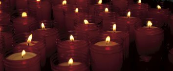 a group of glowing candles lights the way