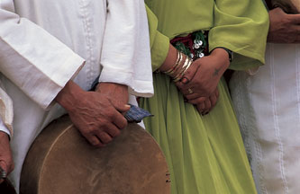 Group of men with one holding a drum